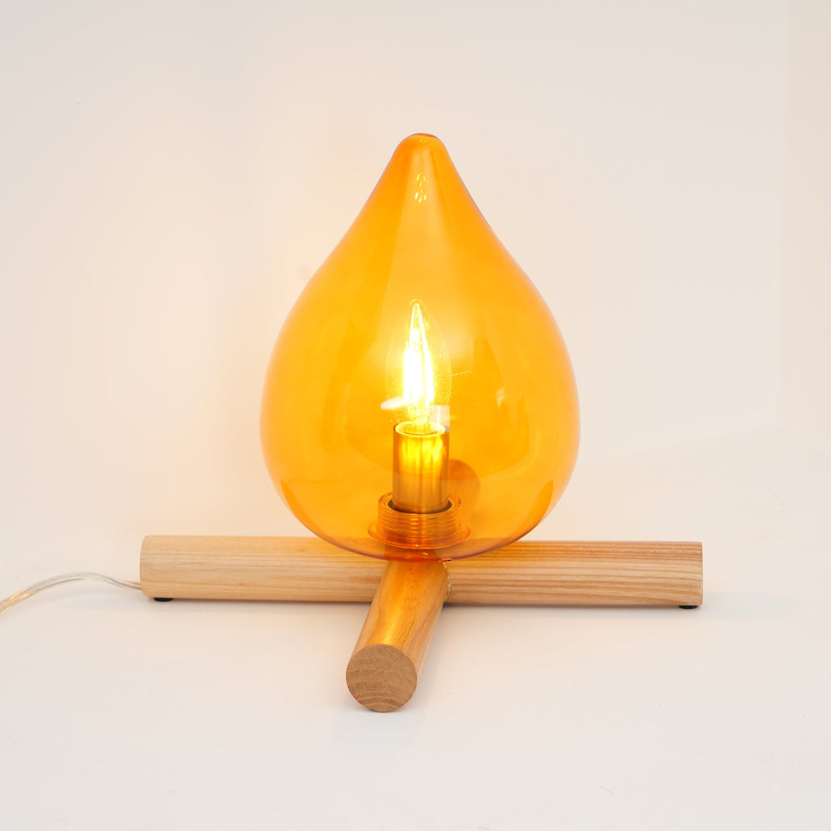 Flame-Inspired Glass Table Lamp With Wooden Cross Base
