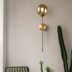Mid Century Glass Globe Wall Light with Long Brass Stem and E27 Fitting