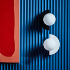 Modern Glass Globe Wall Light with Colourful Semicircle Backplate