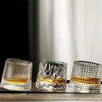 Rotating Whisky Glass with Textured Tilted Base for Swirling Spirits